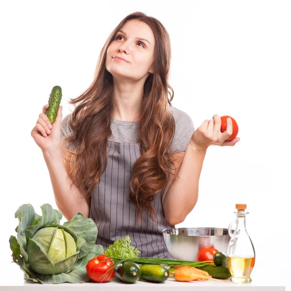 Young Woman Cooking in the kitchen. Healthy Food - Vegetable Salad. Diet. Dieting Concept. Healthy Lifestyle. Cooking At Home. Royalty Free Stock Images