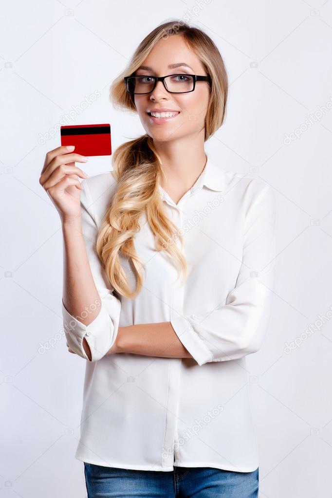 a young business woman holding new credit card