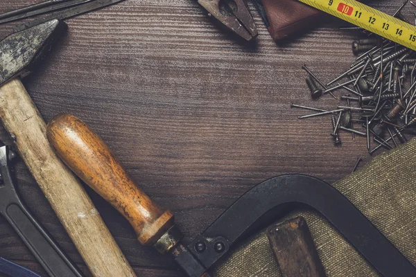 Construction instruments on the wooden background — Stock Photo, Image