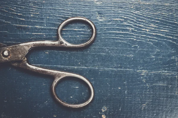 Old scissors on the wooden background — Stock Photo, Image