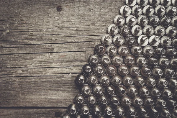 Bolts on the wooden table — Stock Photo, Image