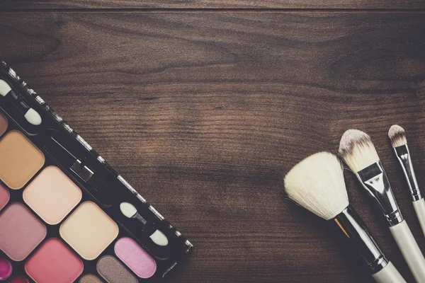 White make-up brushes on wooden background — Stock Photo, Image