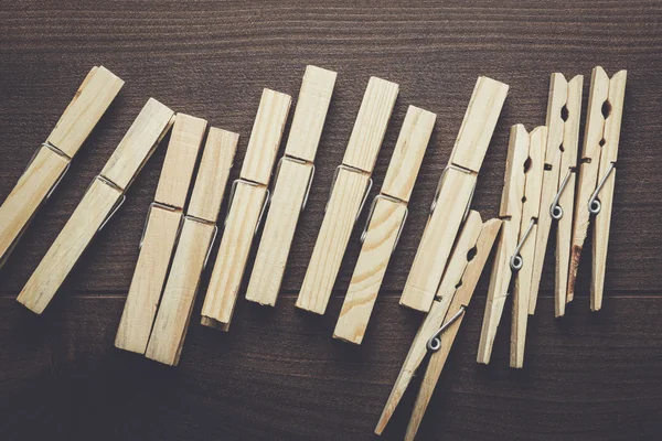 Wooden clothes pegs on the table — Stock Photo, Image