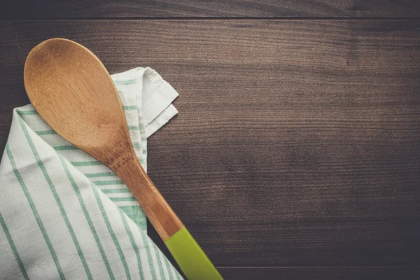 Wooden spoon on the brown table — Stock Photo, Image