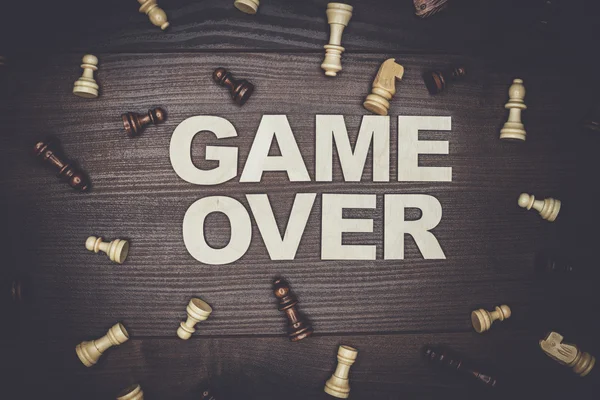 Game over concept on wooden background — Stock Photo, Image