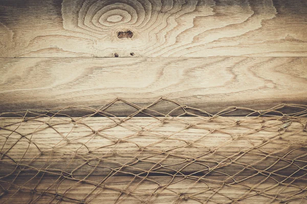 Textura de fondo de madera y red de pesca — Foto de Stock