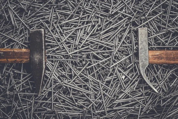 Old hammers and nails on table — Stock Photo, Image