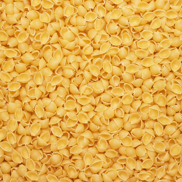 Сухой сырой макаронный фон — стоковое фото