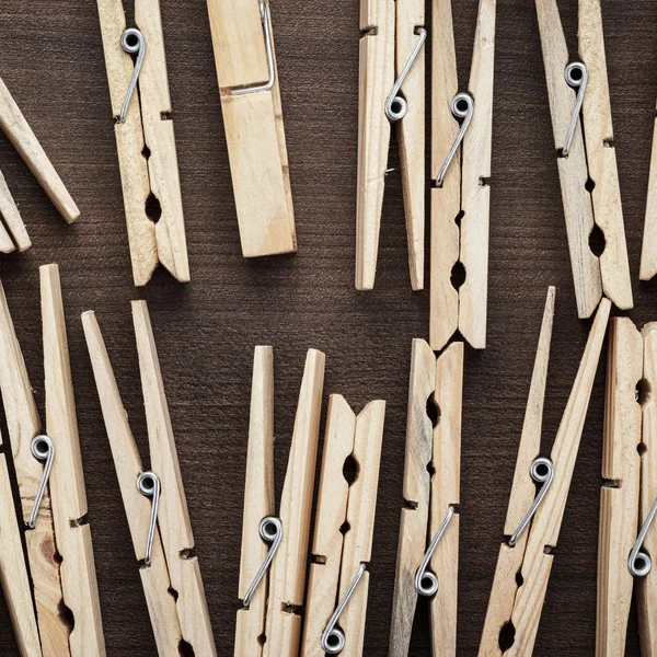 Wooden clothes pegs on the table — Stock Photo, Image