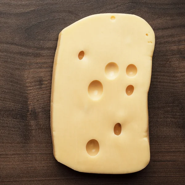 Small and big pieces of cheese — Stock Photo, Image