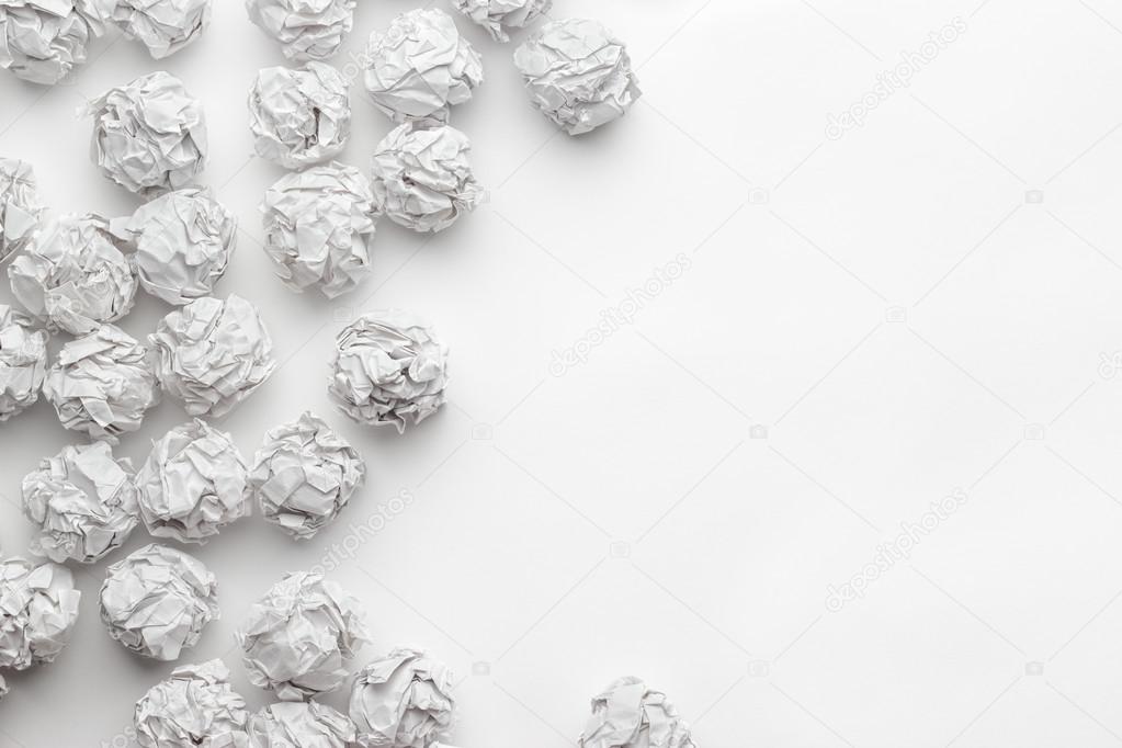 crumpled paper on white table brainstorming concept