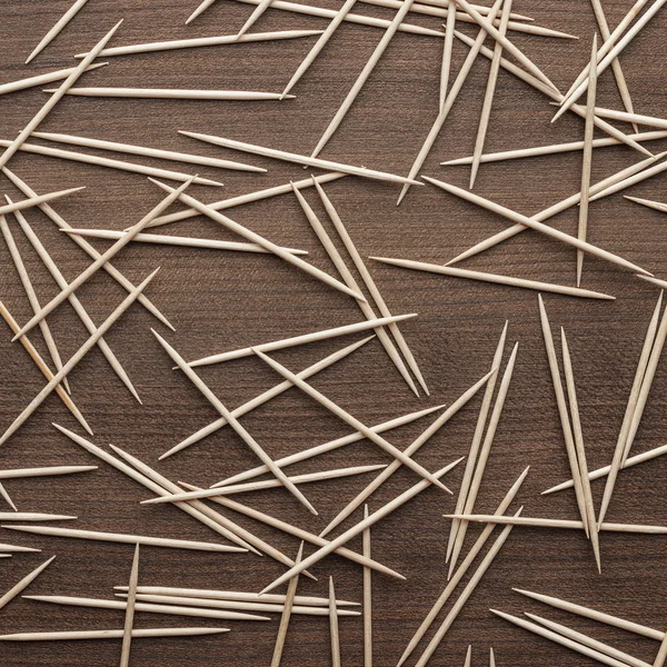 Wooden toothpicks on the table background — Stock Photo, Image