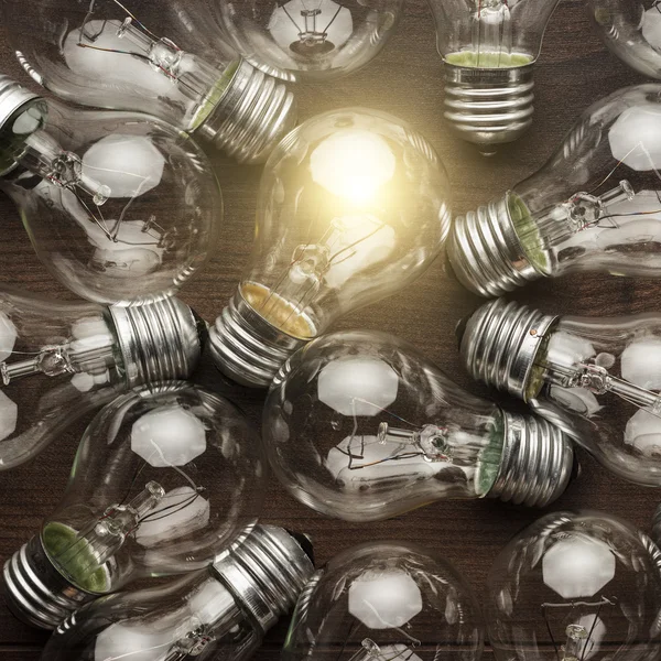 Glowing bulb uniqueness concept — Stock Photo, Image
