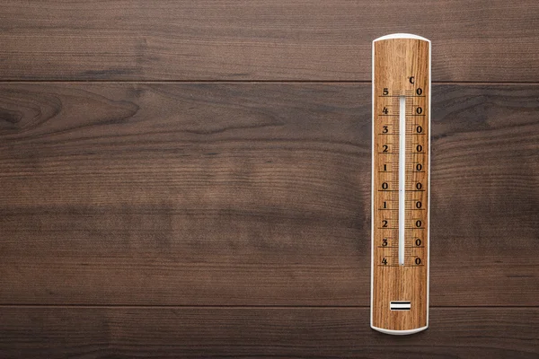 Wooden thermometer on the table — Stock Photo, Image