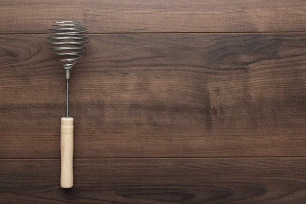 Retro egg whisk with wooden handle — Stock Photo, Image