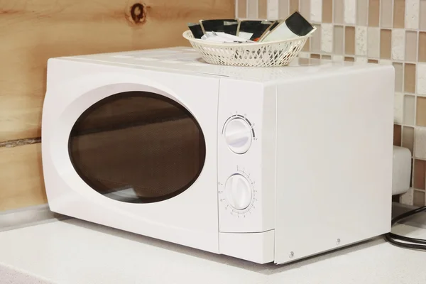 Microwave  on the table — Stock Photo, Image