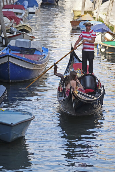 gondola sails down the channel in Venice