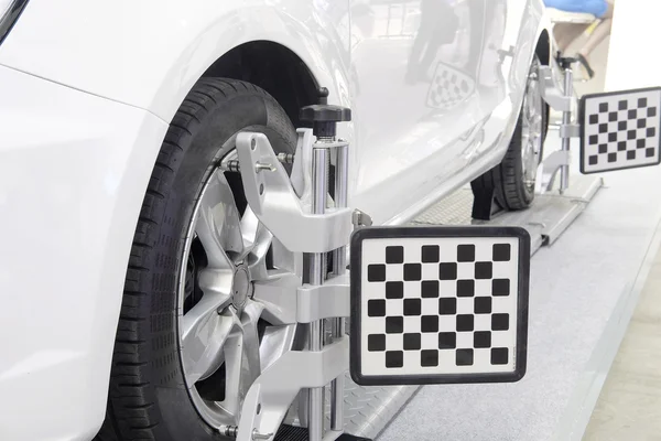 Wheel alignment equipment on a car — Stock Photo, Image