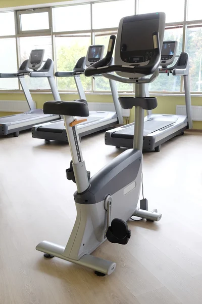 Fitness hall with sport bicycles and treadmills — Stock Photo, Image