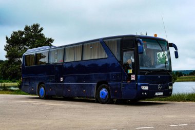 Ostashkov, Russia - June, 14, 2021: tourist bus on a bus station in Ostashkov, Russia