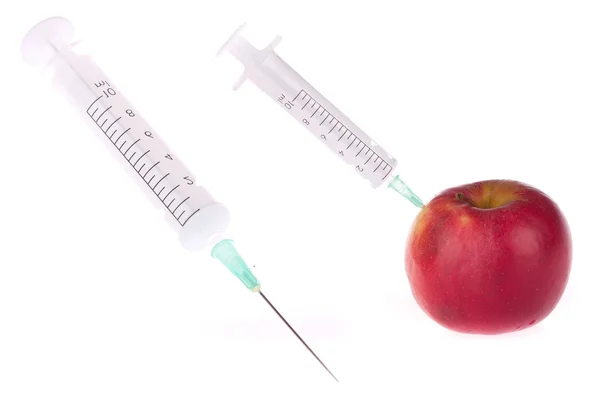 Syringe in apple — Stockfoto