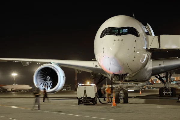 Passenger planes at the airport in the evening — Stock Photo, Image