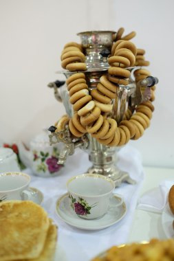 Bread rings ,samovar and cups clipart