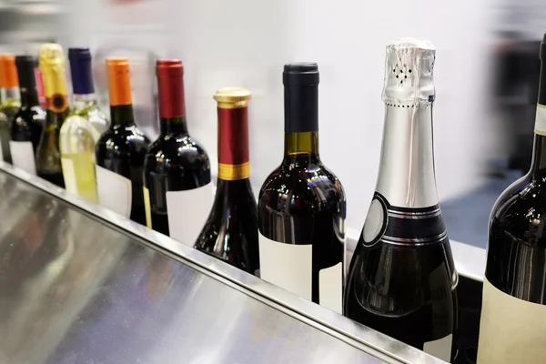 Wine bottles on a counter — Stock Photo, Image