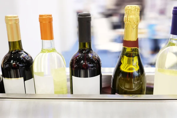 Wine bottles on a counter — Stock Photo, Image