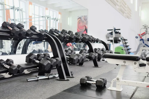 Dumbells in a rack — Stock Photo, Image