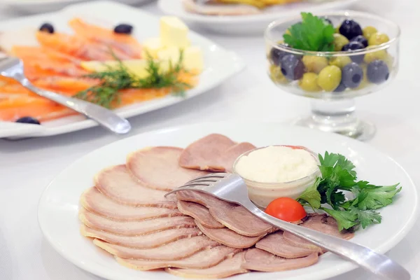 Dishes and food on the served table — Stock Photo, Image