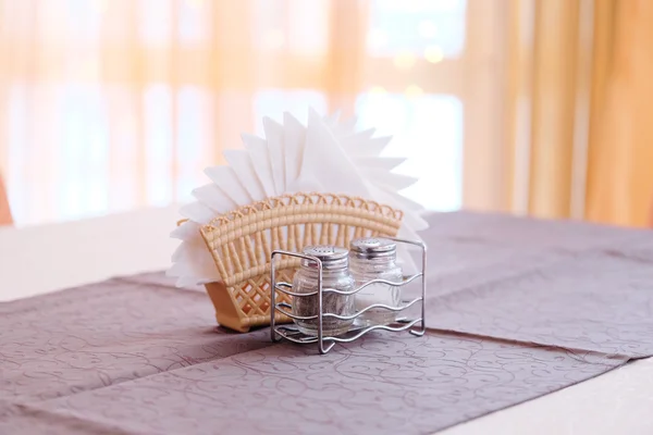 Napkins, salt shaker and pepper — Stock Photo, Image