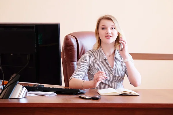 Smiling blonde secretary in the office — Stock Photo, Image