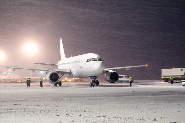 Plane parked at the airport in winter