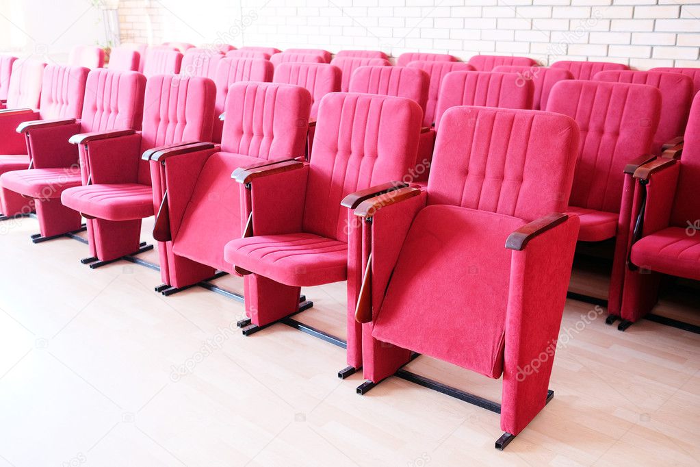 Red recliners stand rows