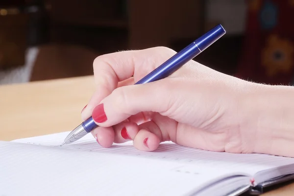 Ręka z długopisem i notatnikiem Obrazek Stockowy