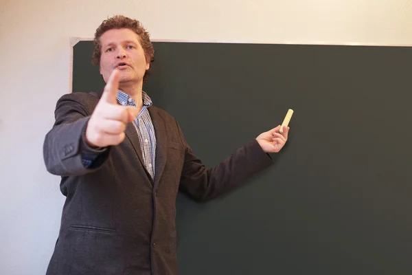 Male teacher calling on student — Stock Photo, Image