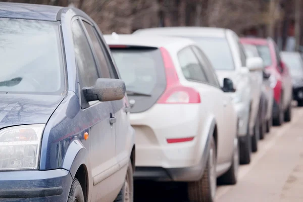 Vehicles parked in parking lot — Stock Photo, Image