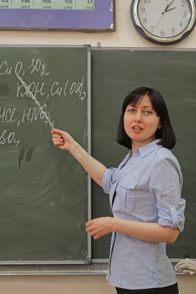 Woman teacher  at a school board — Stock Photo, Image