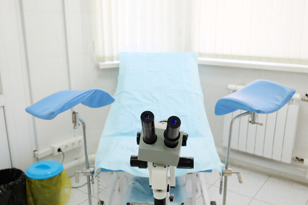 Gynecological chair in room