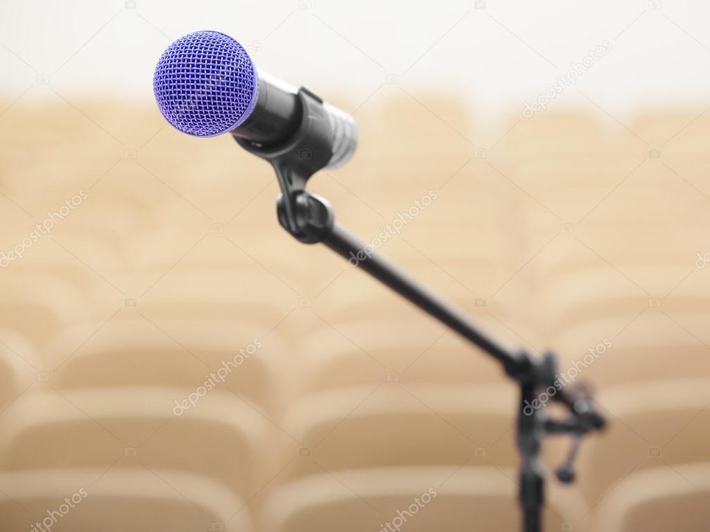 Microphone and blurred auditorium