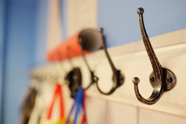 Interior of a cloakroom with hooks — Stock Photo, Image