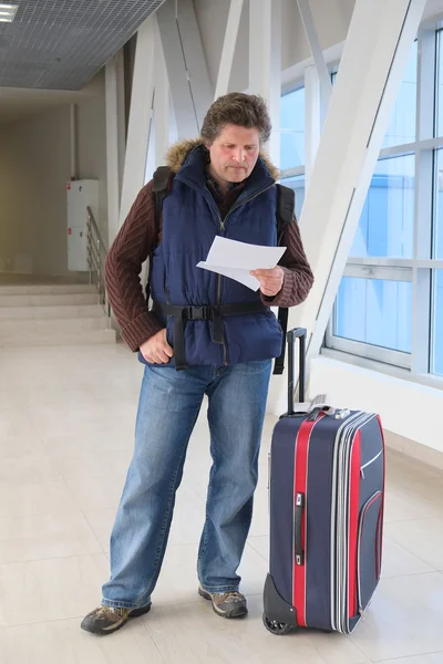 Tourist standing with suitcase — Stock Photo, Image