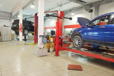 Cars in dealer repair station in Tula clipart