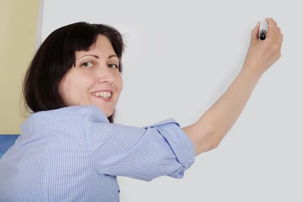 Woman speaker near  board — Stock Photo, Image