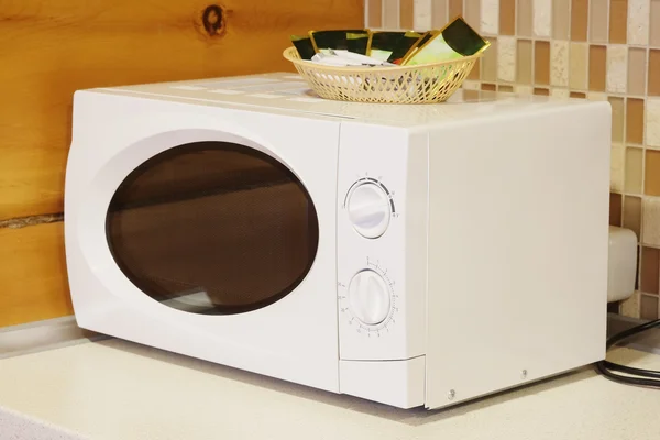 Microwave  on the table — Stock Photo, Image