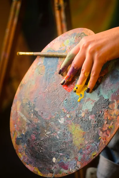 Artist\'s hand with the brushes