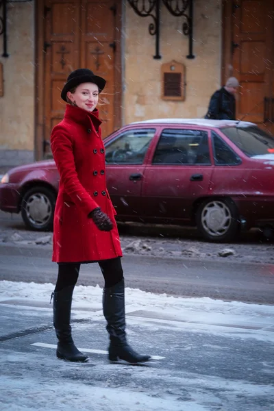 Girl in a red coat — Stock Photo, Image