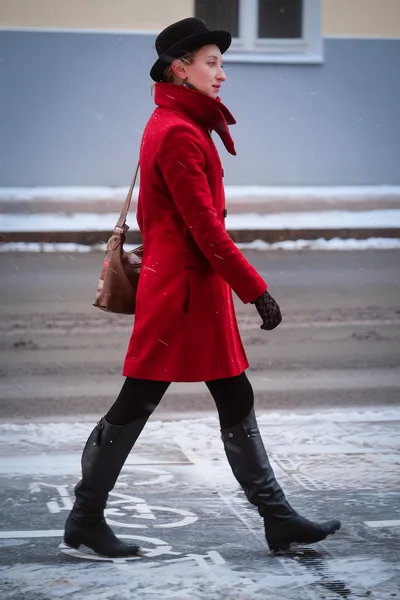Girl in a red coat — Stock Photo, Image