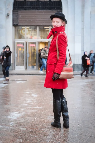 Girl in a red coat — Stock Photo, Image